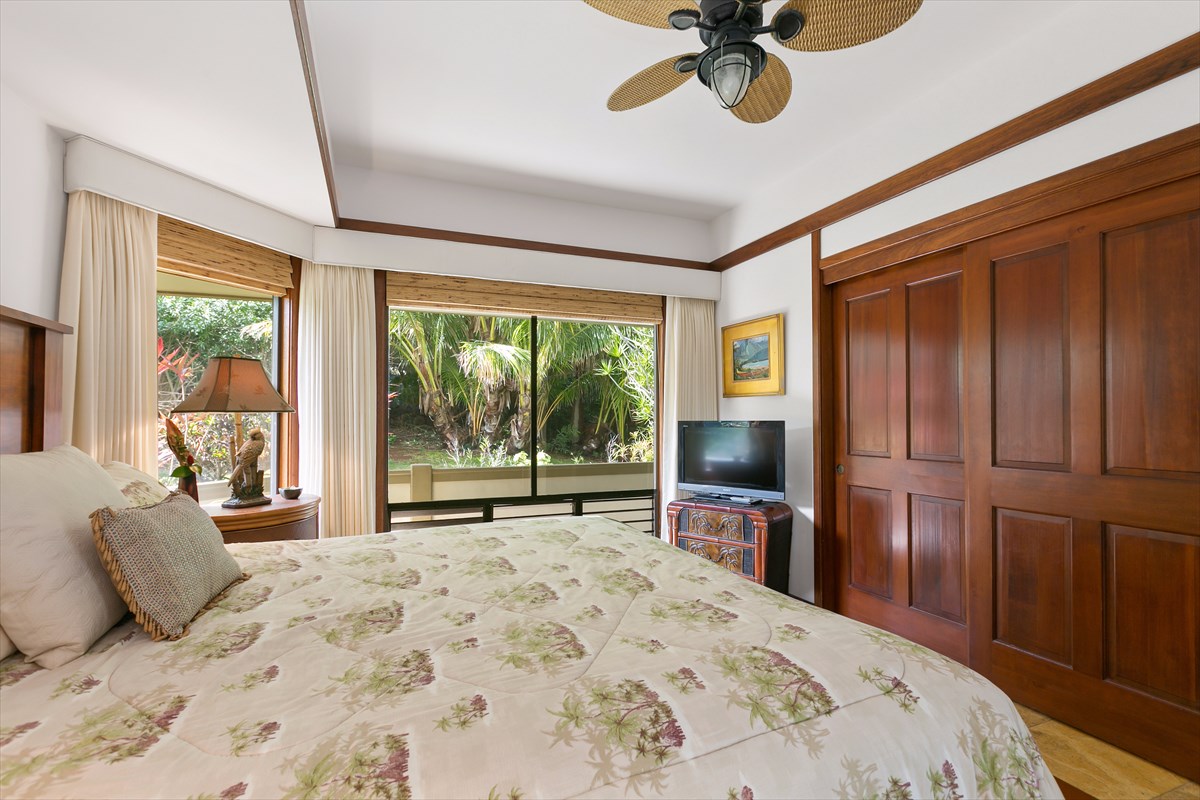 1516 Pe'e Road Koloa, HI 96756 - Photo 17 of 25 a bedroom with a bed and a large window with the outer view