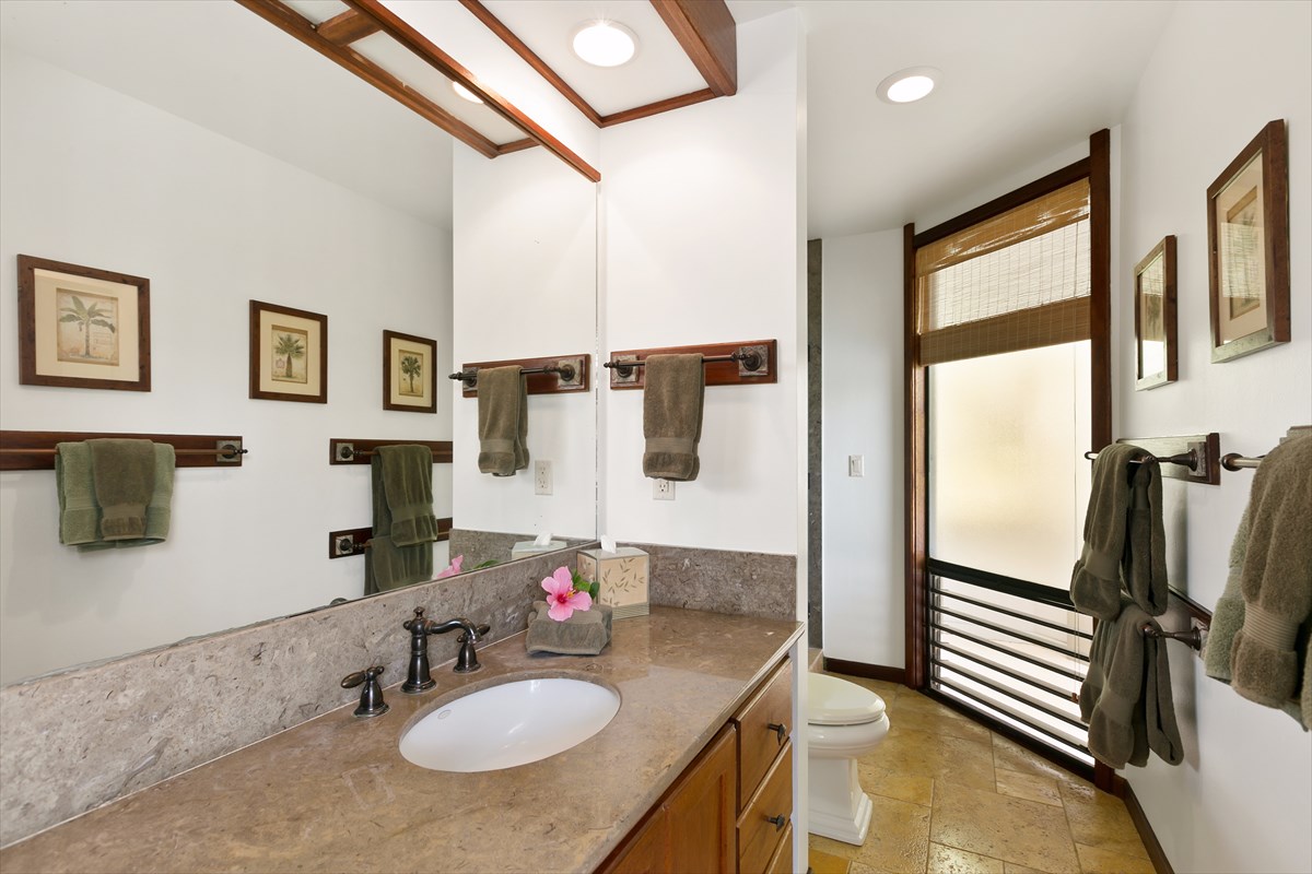 1516 Pe'e Road Koloa, HI 96756 - Photo 18 of 25 a bathroom with a granite countertop sink and a mirror