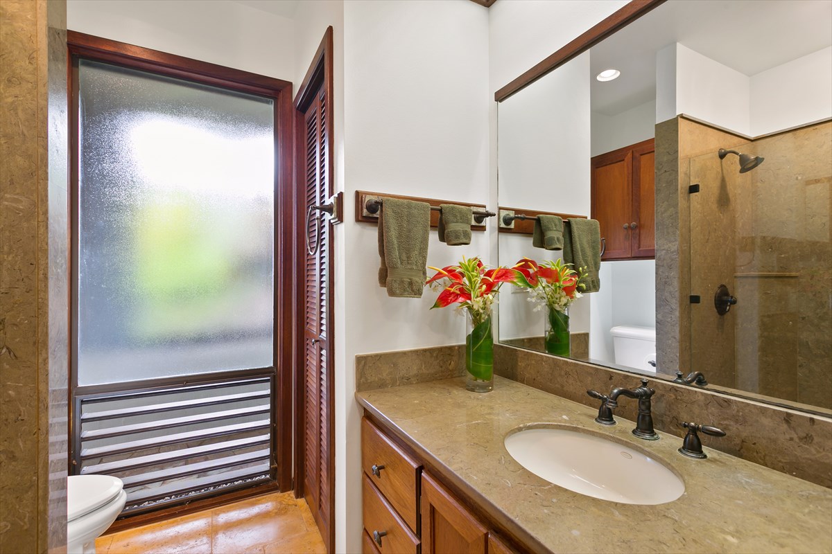 1516 Pe'e Road Koloa, HI 96756 - Photo 22 of 25 a bathroom with a granite countertop sink and a mirror