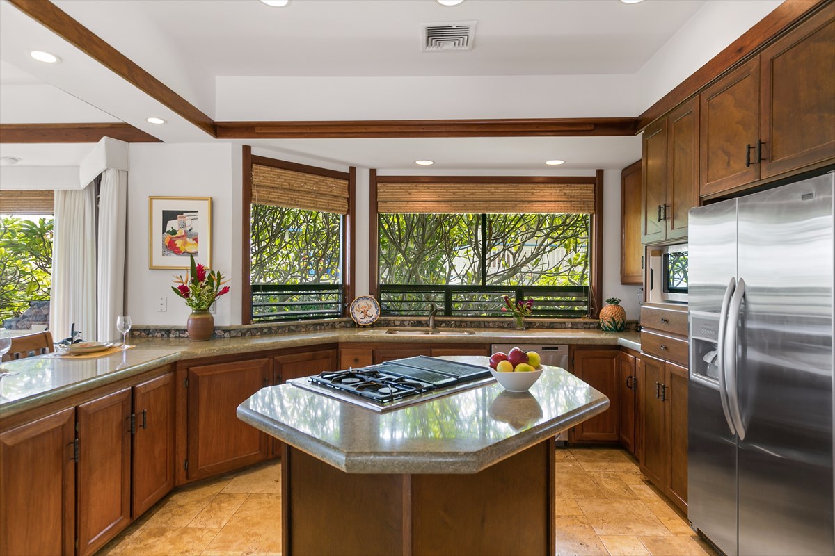 1516 Pe'e Road Koloa, HI 96756 - Photo 8 of 25 a kitchen with a stove a sink and a refrigerator