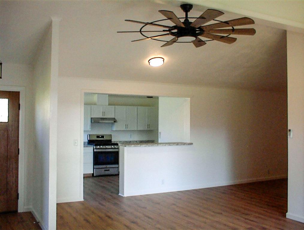 37702 Squaw Valley Road Squaw Valley, CA 93675 - Photo 11 of 42 a kitchen with stainless steel appliances granite countertop a stove a sink and a refrigerator