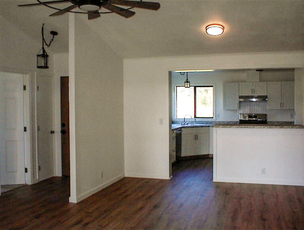 37702 Squaw Valley Road Squaw Valley, CA 93675 - Photo 13 of 42 a view of kitchen with a sink wooden floor and cabinets
