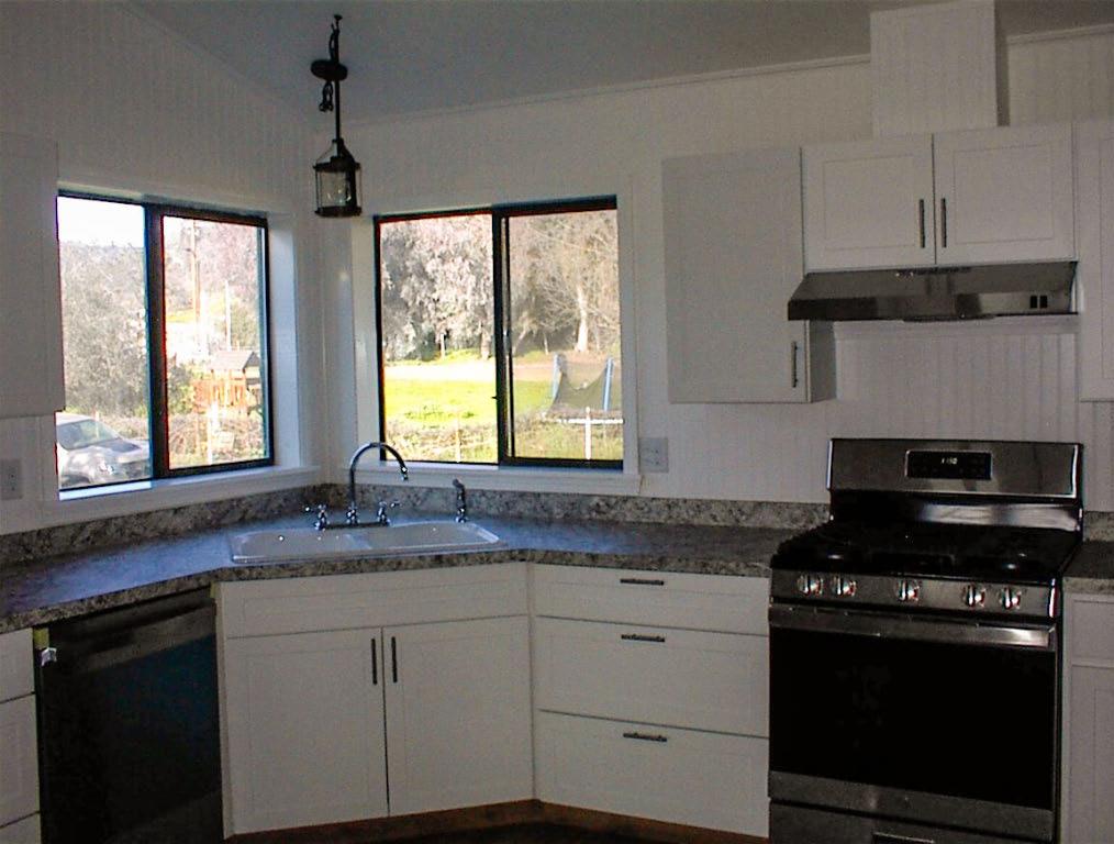 37702 Squaw Valley Road Squaw Valley, CA 93675 - Photo 16 of 42 a kitchen with granite countertop stainless steel appliances a sink stove and window