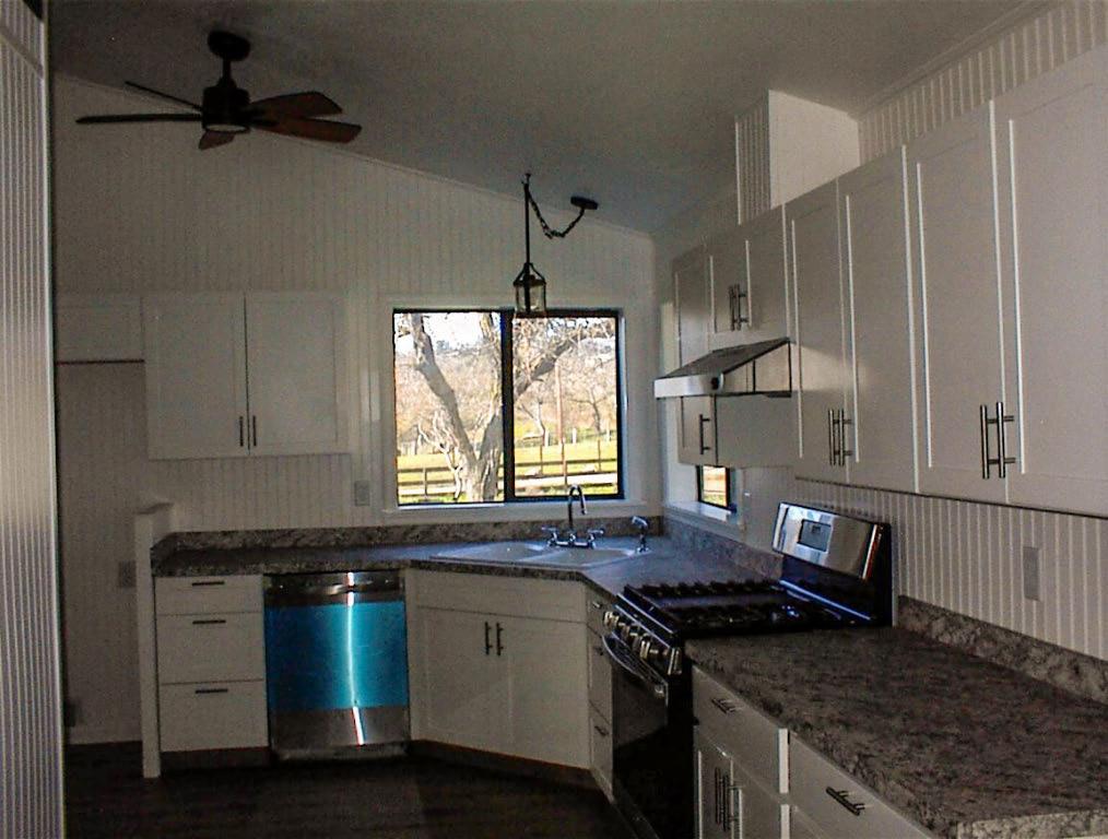 37702 Squaw Valley Road Squaw Valley, CA 93675 - Photo 17 of 42 a kitchen with granite countertop a sink appliances cabinets and a window