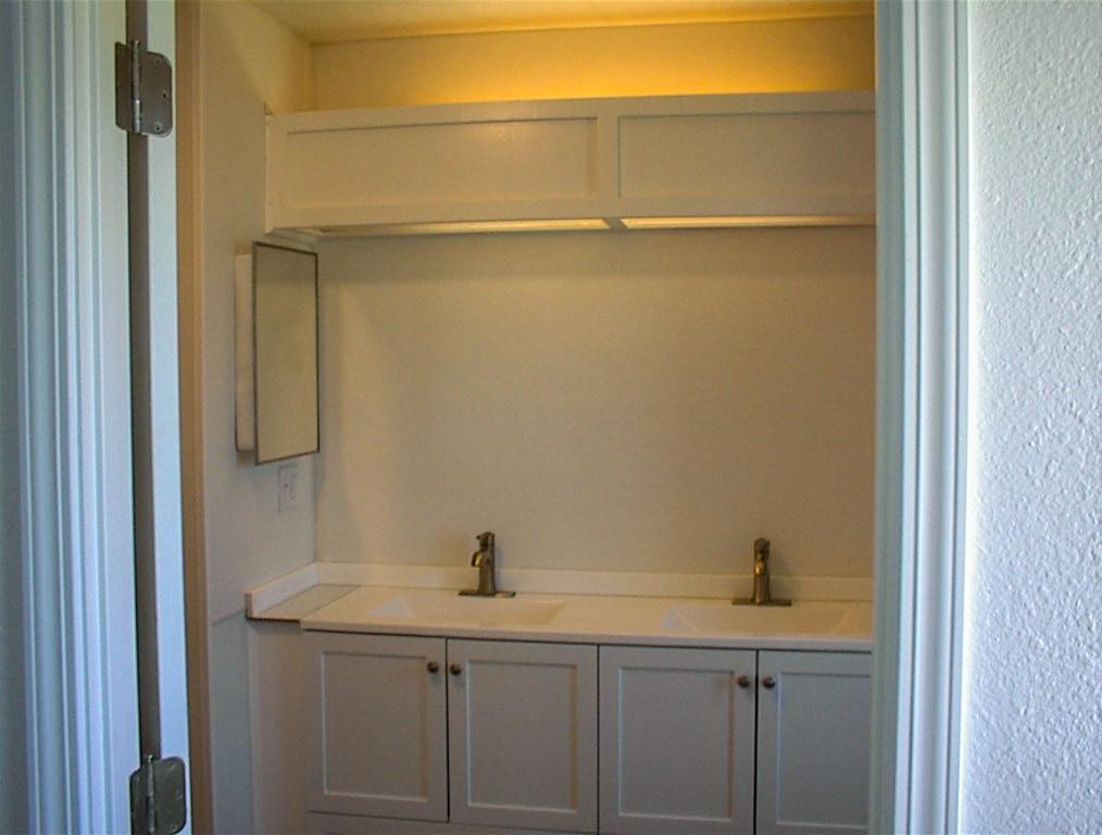 37702 Squaw Valley Road Squaw Valley, CA 93675 - Photo 21 of 42 a bathroom with a sink and mirror