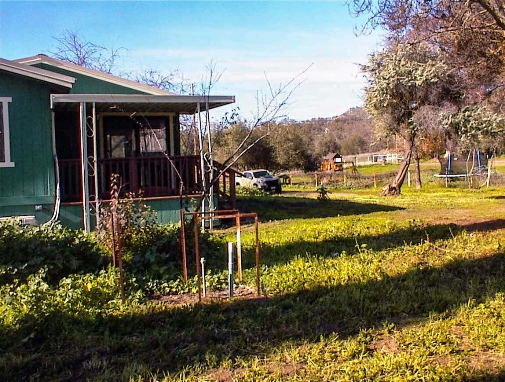 37702 Squaw Valley Road Squaw Valley, CA 93675 - Photo 9 of 42 a view of a house with a yard