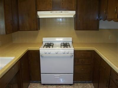 705 East Sycamore Avenue Reedley, CA 93654 - Photo 11 of 12 Kitchen with new oven/range and hood.