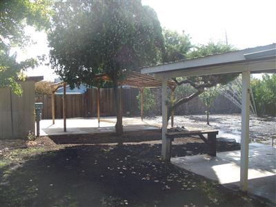 705 East Sycamore Avenue Reedley, CA 93654 - Photo 12 of 12 Covered patio, & storage shed