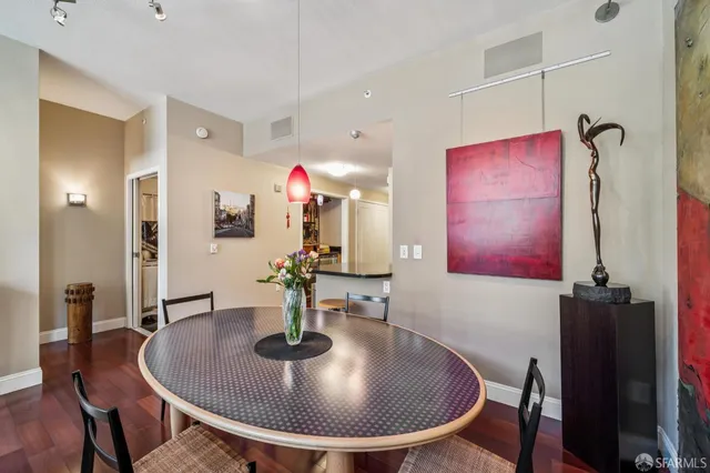 a dining room with table and chairs