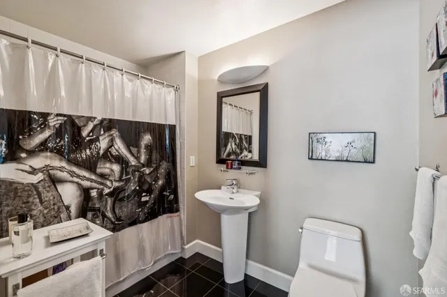 a bathroom with a sink and mirror