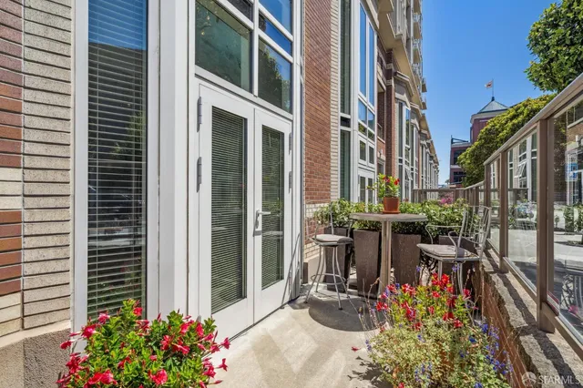 a view of a house with yard and sitting area
