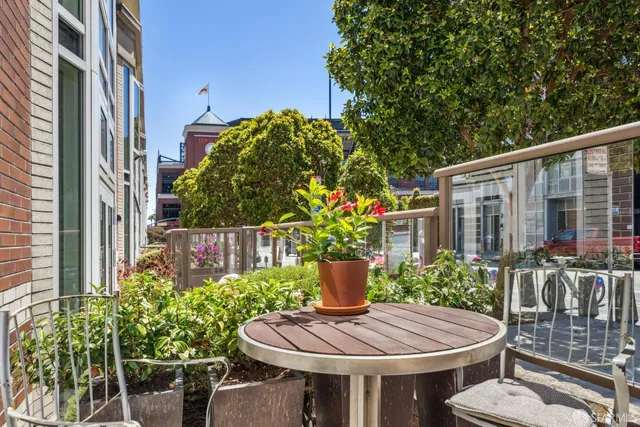 a view of a patio filled with furniture