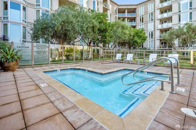 a view of a swimming pool with a lounge chairs