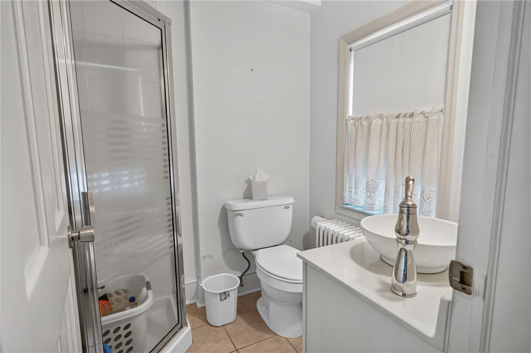 765 East Macada Road Bethlehem, PA 18017 - Photo 21 of 46 Functional full bath with a standing shower and a vessel sink on a clean white vanity.