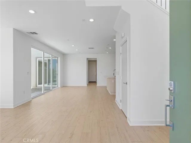 a view of a hallway with an entryway