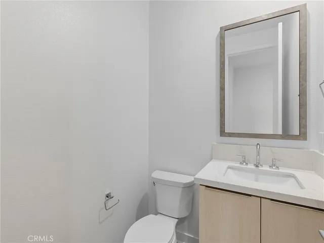a bathroom with a granite countertop sink a shower and a mirror