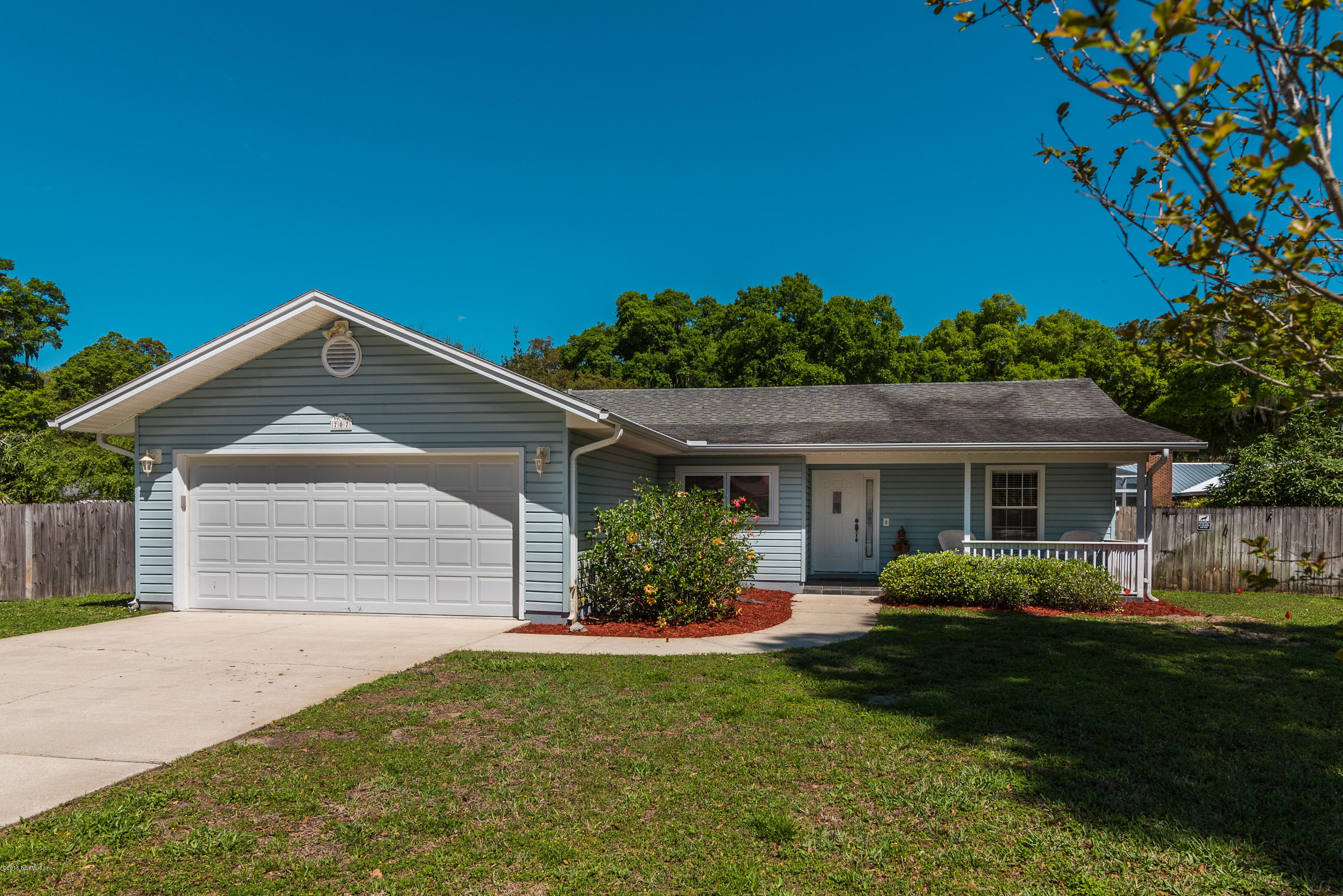 707 Warbler Road St. Augustine, FL 32086 - Photo 1 of 37 a front view of a house with a yard and garage