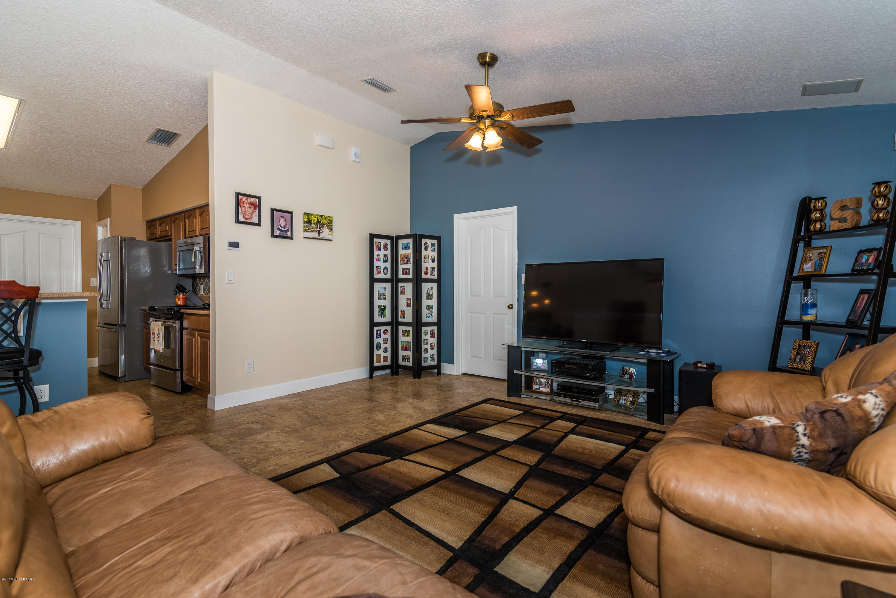 707 Warbler Road St. Augustine, FL 32086 - Photo 12 of 37 a living room with furniture and a flat screen tv
