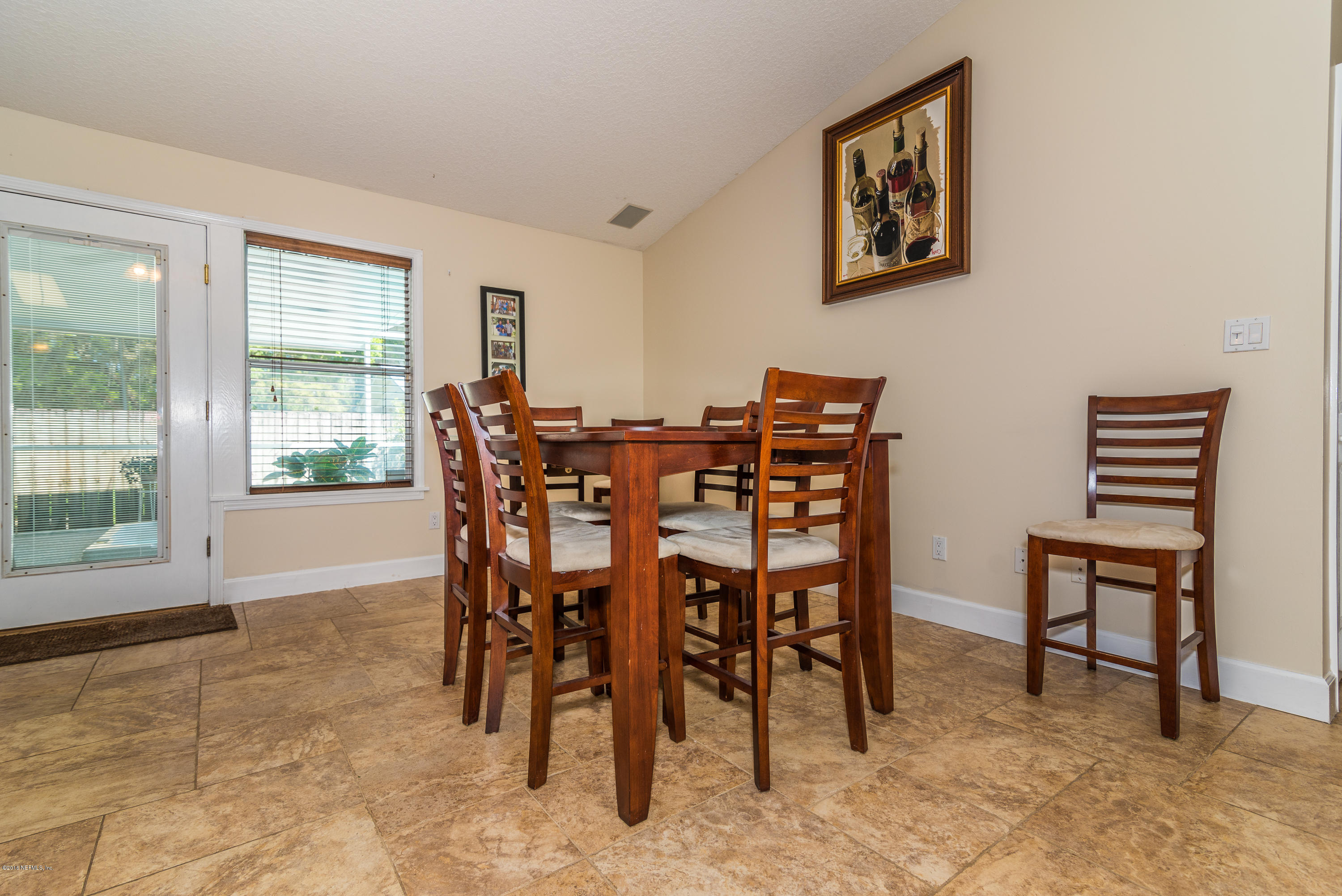 707 Warbler Road St. Augustine, FL 32086 - Photo 13 of 37 a view of a dining room with furniture