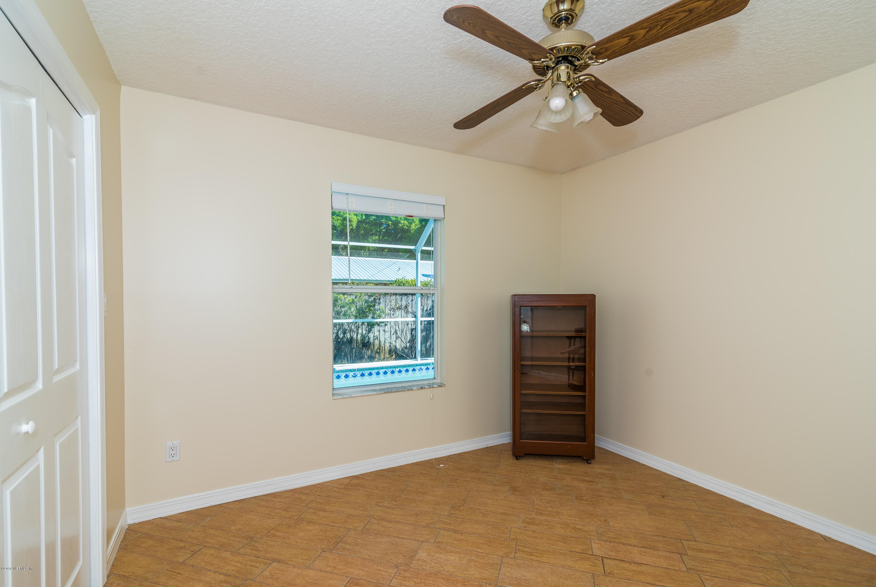 707 Warbler Road St. Augustine, FL 32086 - Photo 18 of 37 an empty room with windows and fan