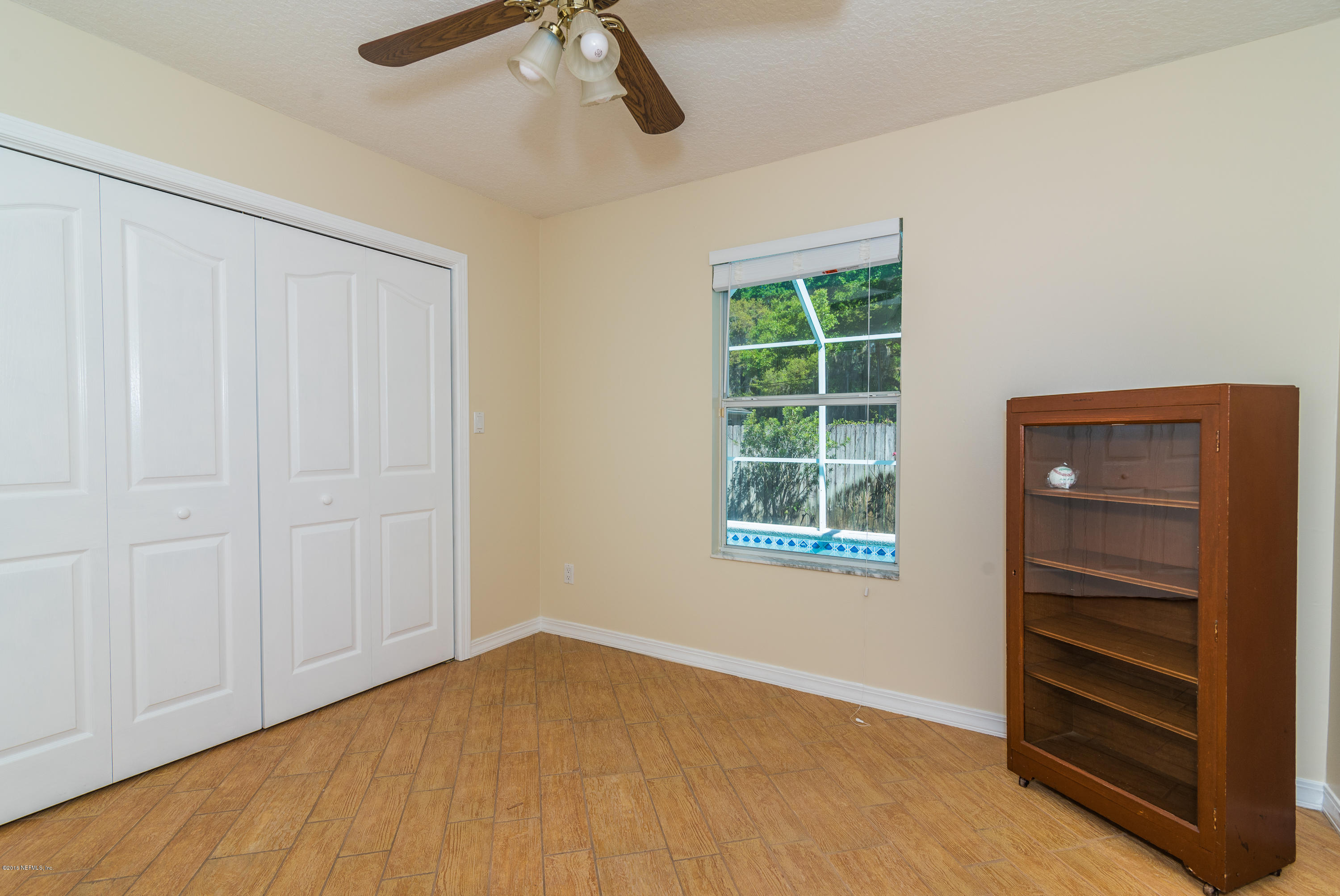 707 Warbler Road St. Augustine, FL 32086 - Photo 19 of 37 a view of an empty room with a window