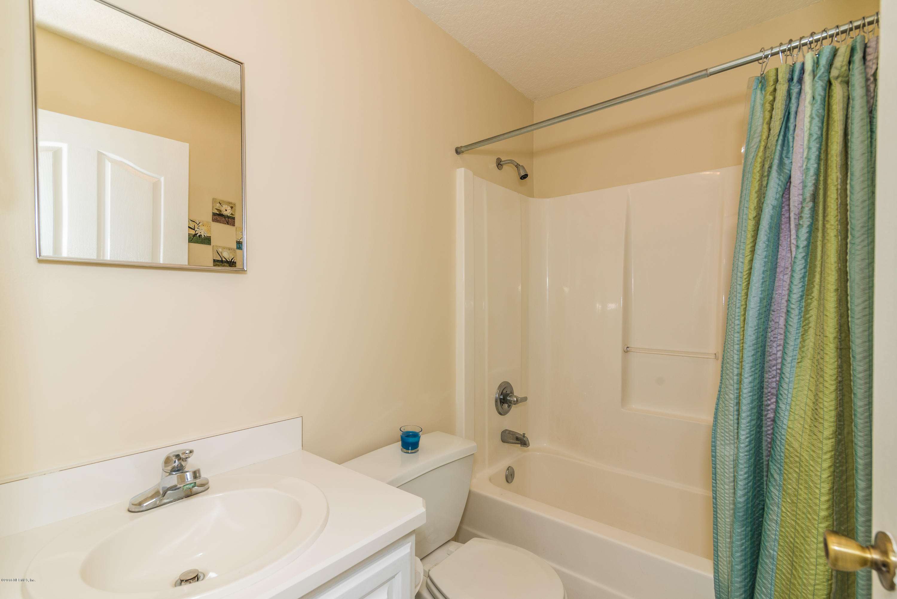 707 Warbler Road St. Augustine, FL 32086 - Photo 20 of 37 a bathroom with a sink toilet and shower