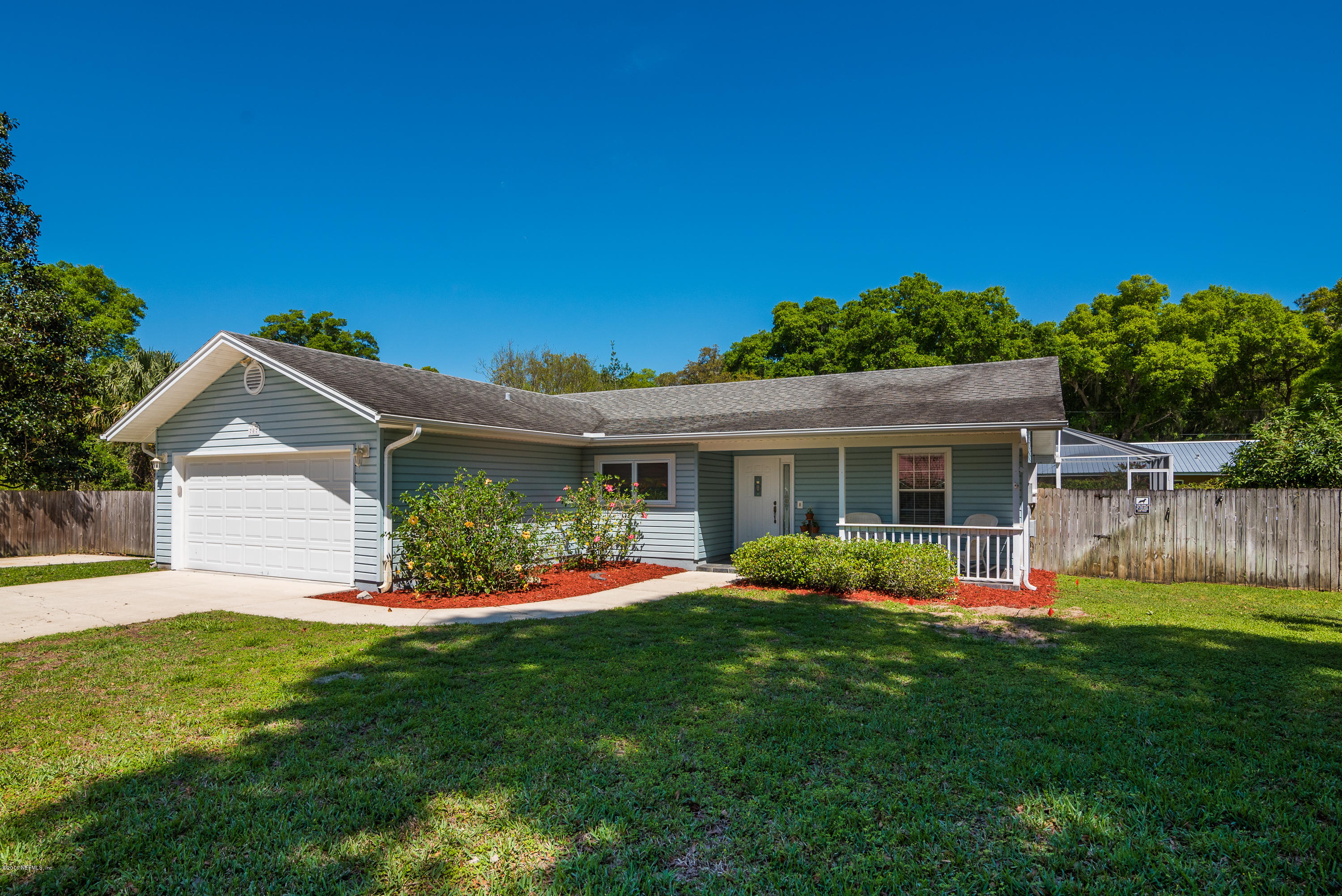 707 Warbler Road St. Augustine, FL 32086 - Photo 2 of 37 a front view of house with yard and outdoor seating