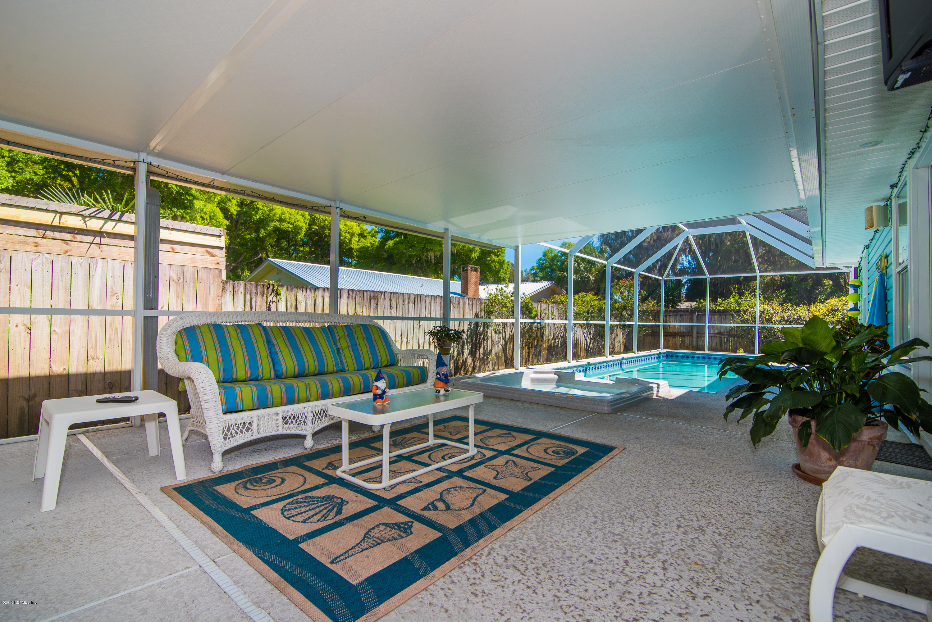 707 Warbler Road St. Augustine, FL 32086 - Photo 25 of 37 a chairs and table in a backyard