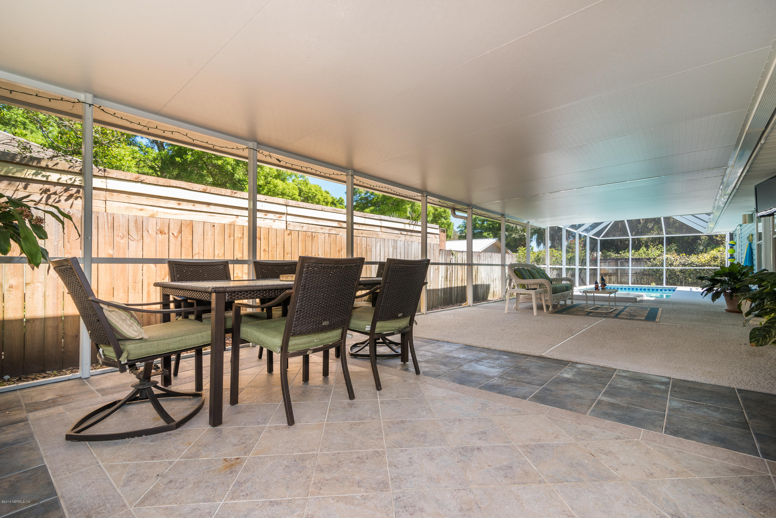 707 Warbler Road St. Augustine, FL 32086 - Photo 26 of 37 a dining room with furniture and outdoor view