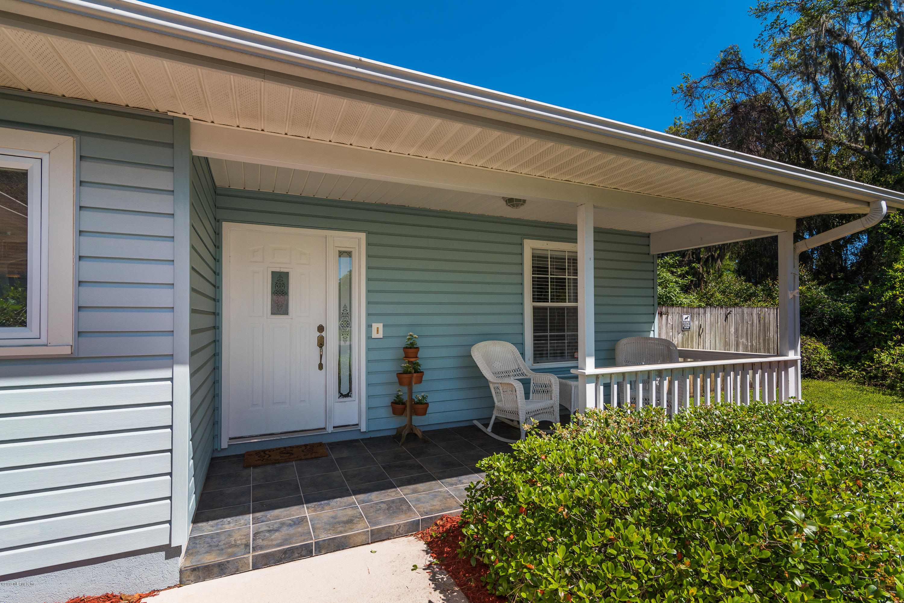 707 Warbler Road St. Augustine, FL 32086 - Photo 3 of 37 a front view of a house with a garden
