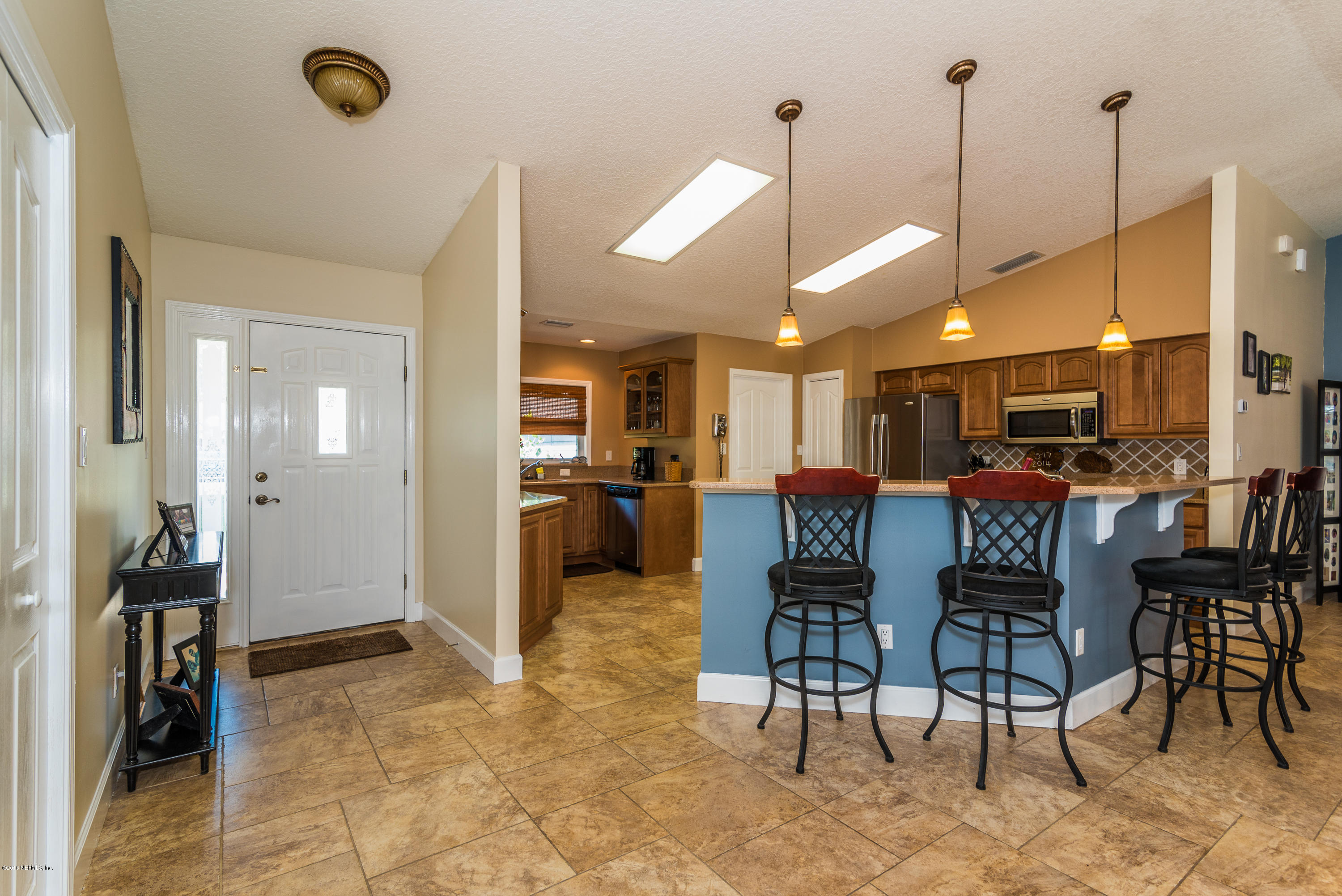 707 Warbler Road St. Augustine, FL 32086 - Photo 5 of 37 a view of a dining room and livingroom