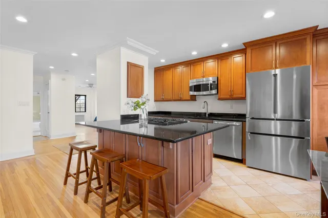 a dining room with granite countertop a coffee table and chairs