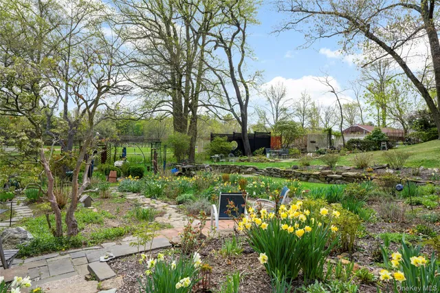 a view of a room with wooden floor and furniture