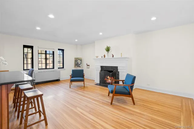 a kitchen with stainless steel appliances granite countertop a stove and a wooden floors