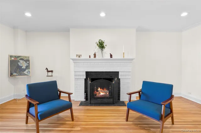 a kitchen with stainless steel appliances granite countertop a refrigerator a sink a stove a dining table and chairs