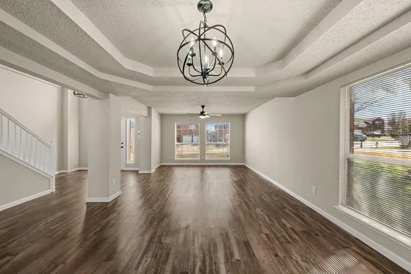 a view of an entryway with wooden floor