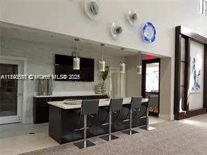 a kitchen with a dining table and chairs