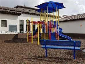 a view of a chairs and table in the patio