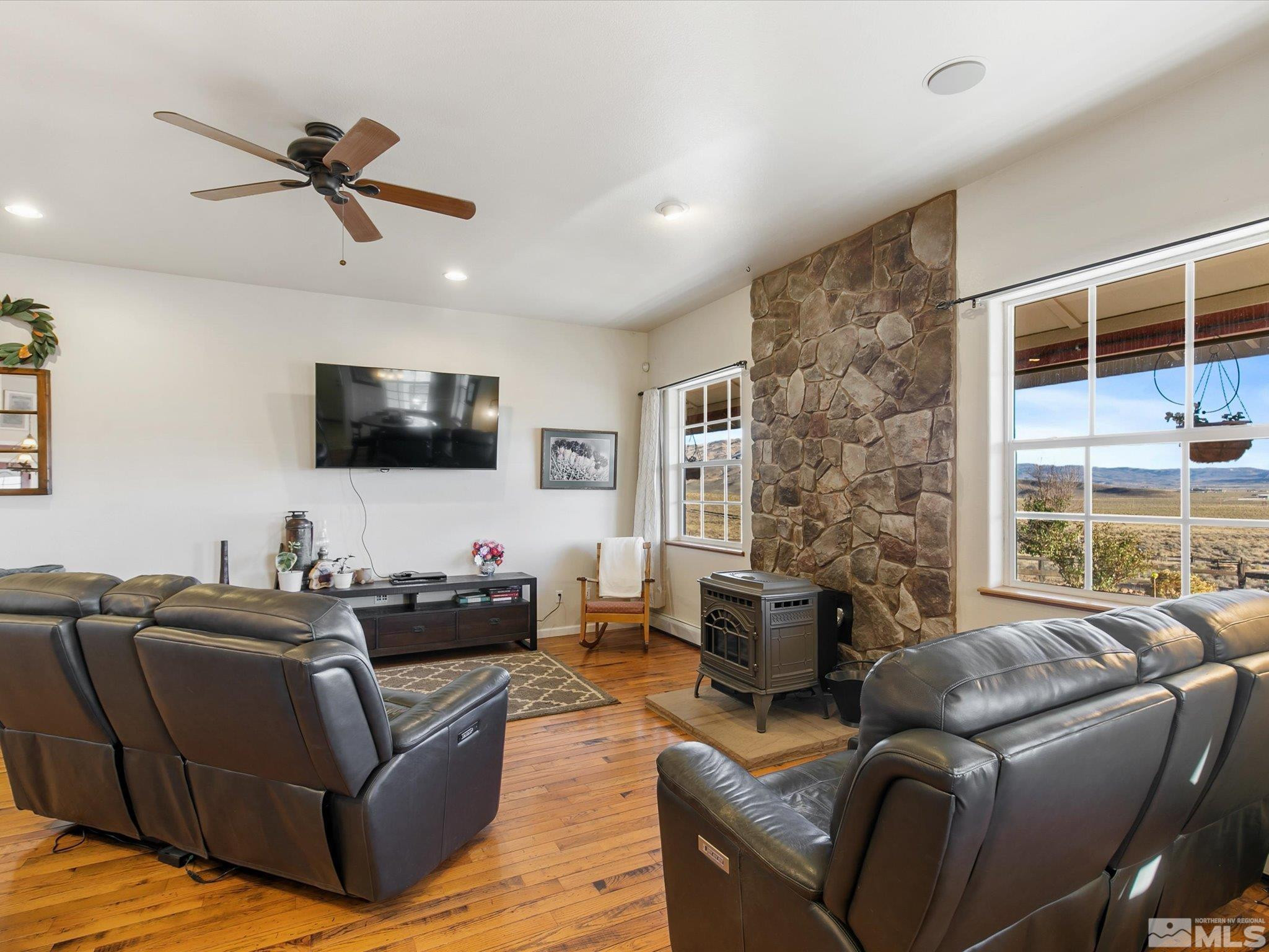 6900 Grass Valley Road Reno, NV 89510 - Photo 12 of 42 a living room with furniture ceiling fan and a window