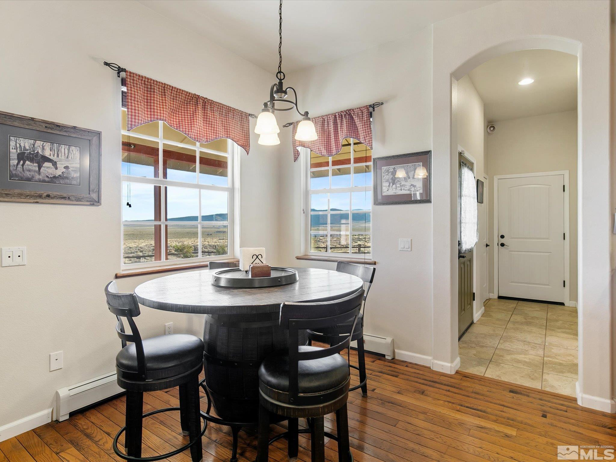 6900 Grass Valley Road Reno, NV 89510 - Photo 14 of 42 a view of a dining room with furniture window and wooden floor