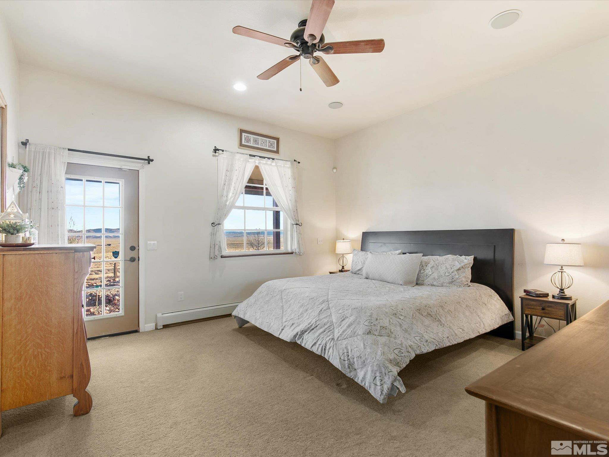 6900 Grass Valley Road Reno, NV 89510 - Photo 15 of 42 a spacious bedroom with a bed and window