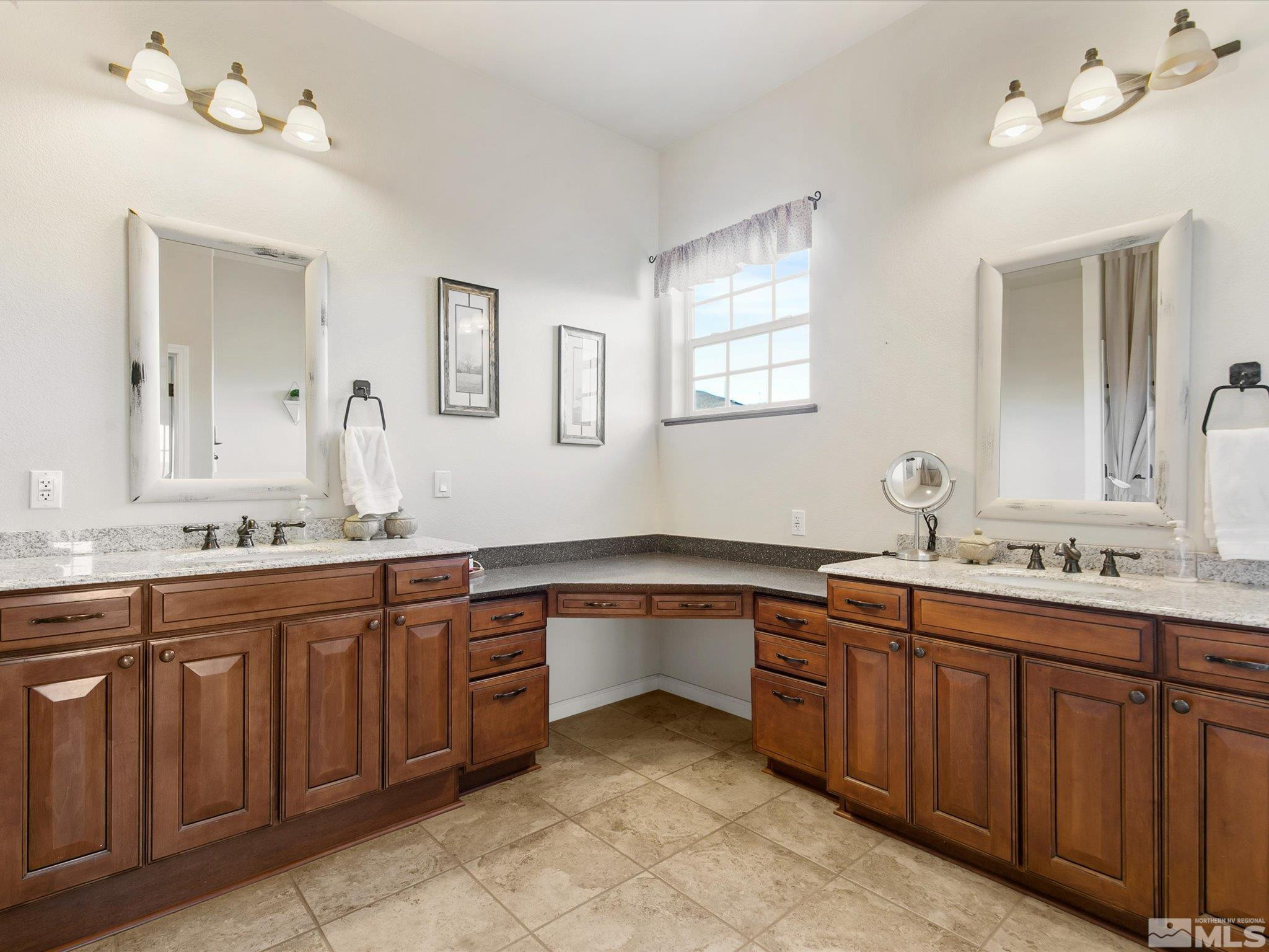 6900 Grass Valley Road Reno, NV 89510 - Photo 17 of 42 a spacious bathroom with a granite countertop sink and a mirror