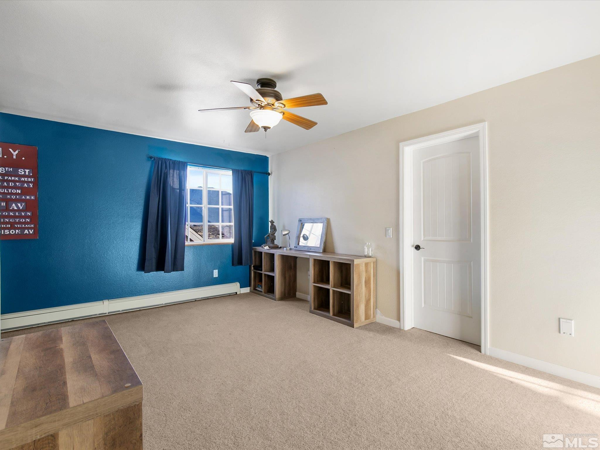 6900 Grass Valley Road Reno, NV 89510 - Photo 27 of 42 a view of a livingroom with a ceiling fan and window