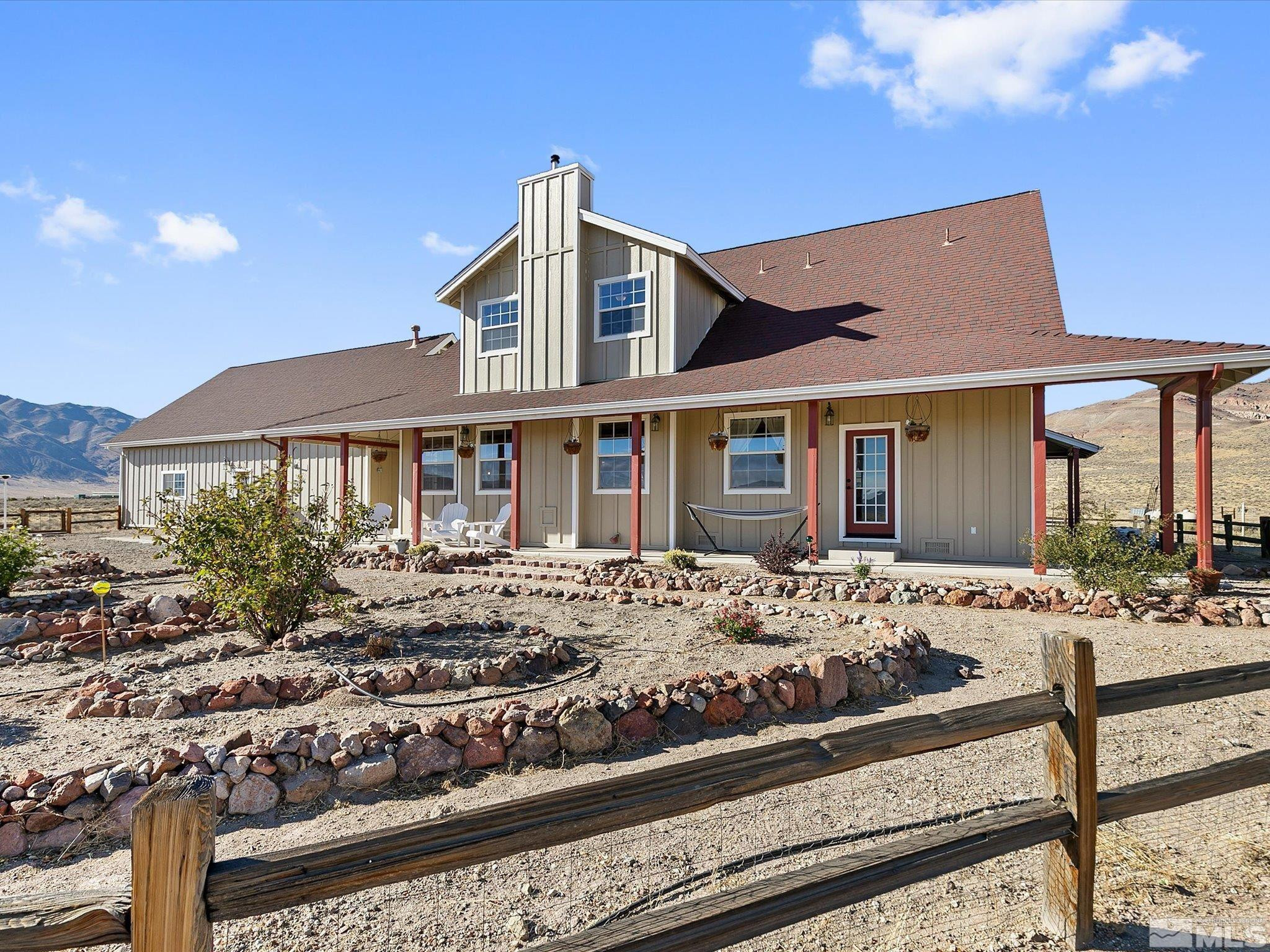 6900 Grass Valley Road Reno, NV 89510 - Photo 29 of 42 a front view of a house with a yard