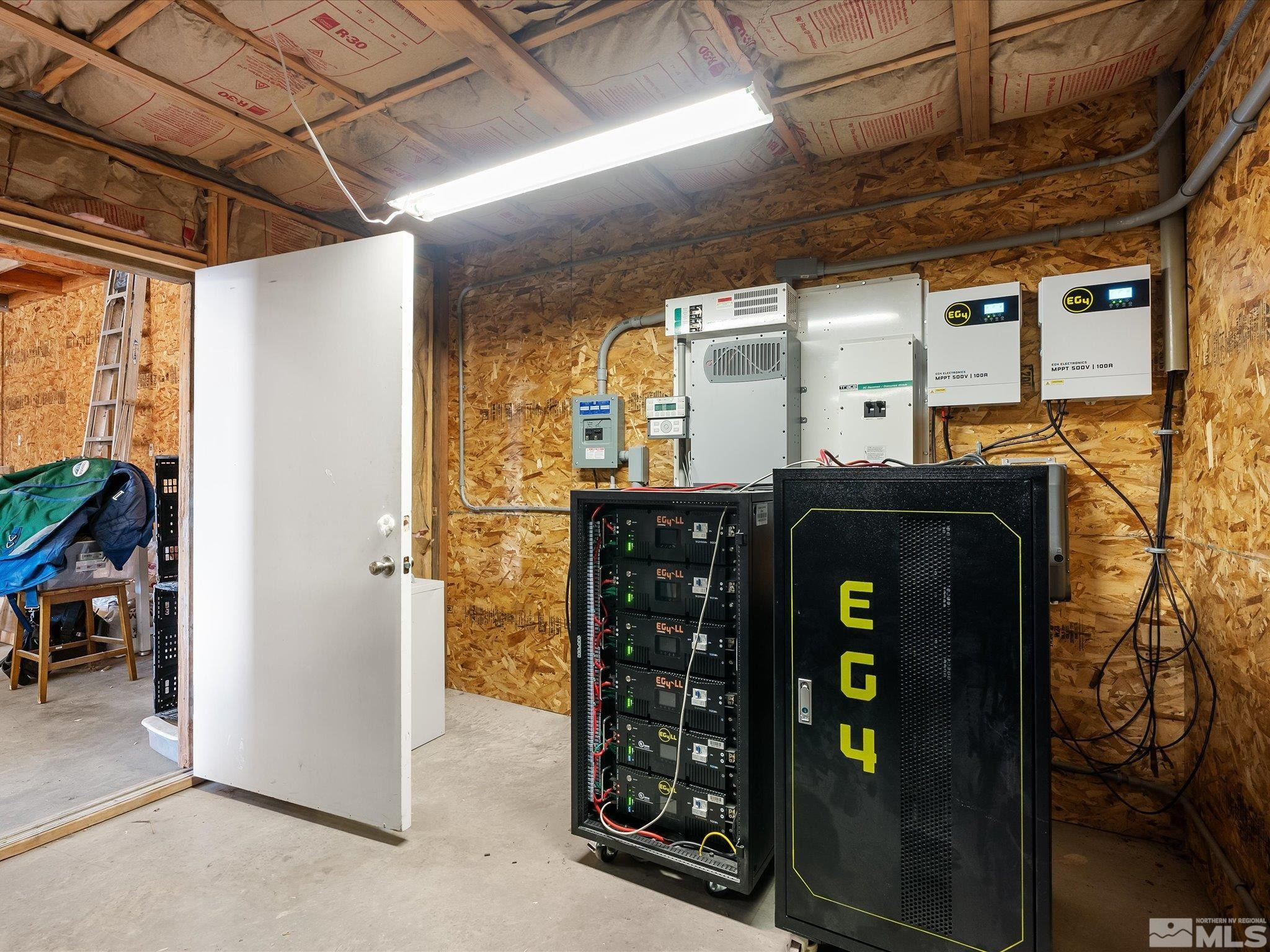 6900 Grass Valley Road Reno, NV 89510 - Photo 32 of 42 a room with stainless steel appliances kitchen island granite countertop a refrigerator and a sink