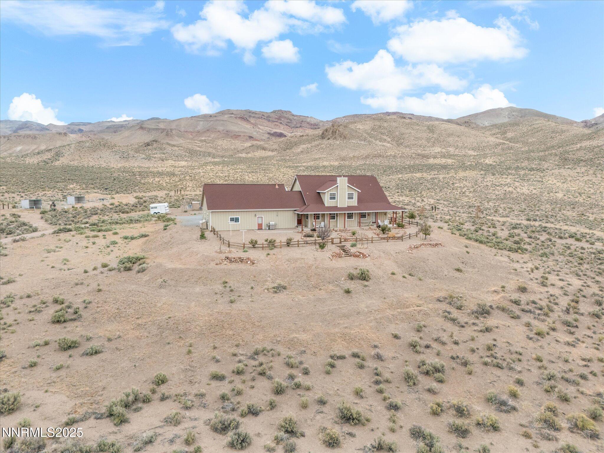 6900 Grass Valley Road Reno, NV 89510 - Photo 39 of 42 a view of a dry field with mountains in the background
