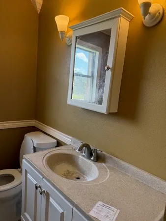 a bathroom with a sink and a toilet