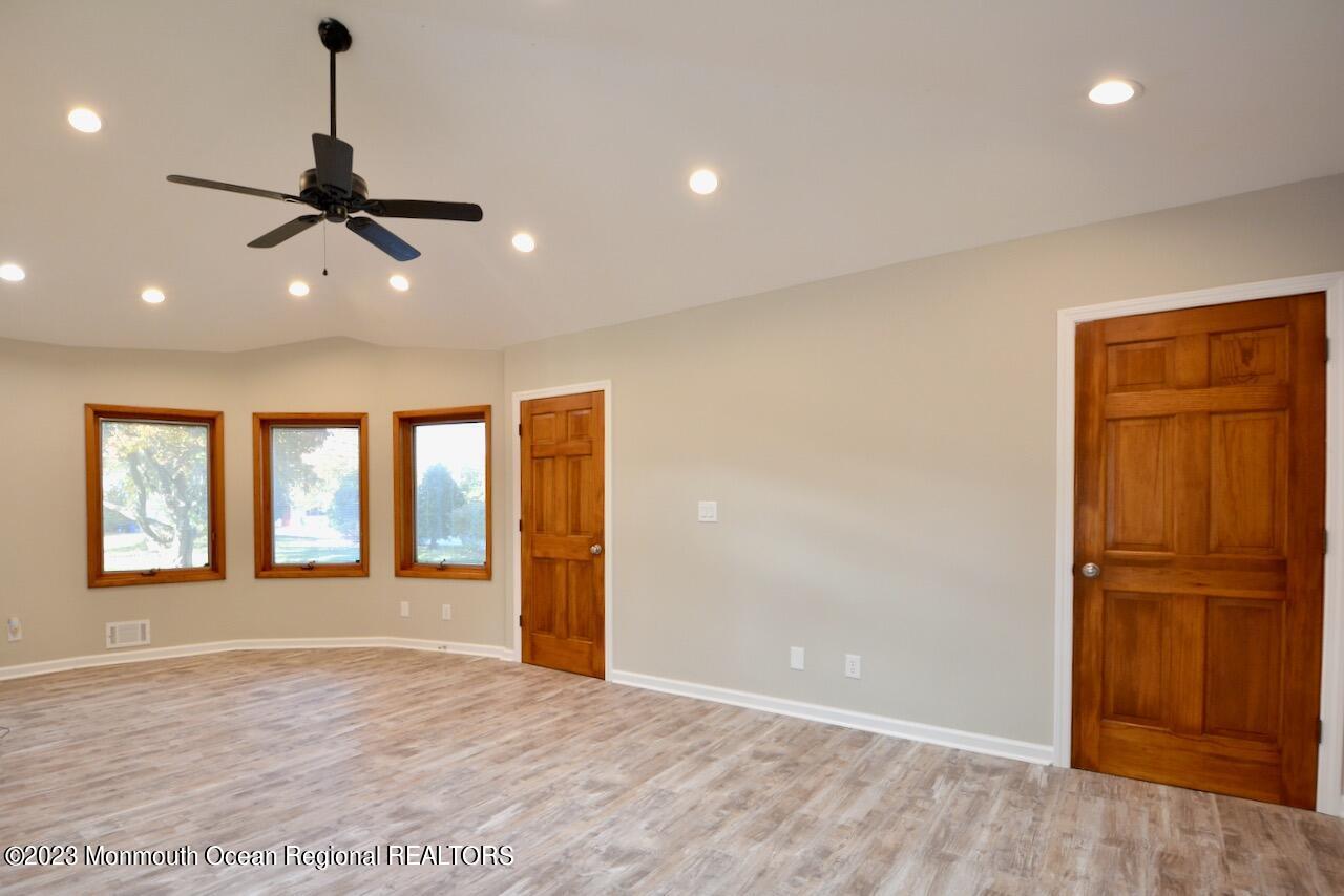 6 Wickatunk Road Manalapan, NJ 07726 - Photo 13 of 35 a view of an empty room with window and cabinet