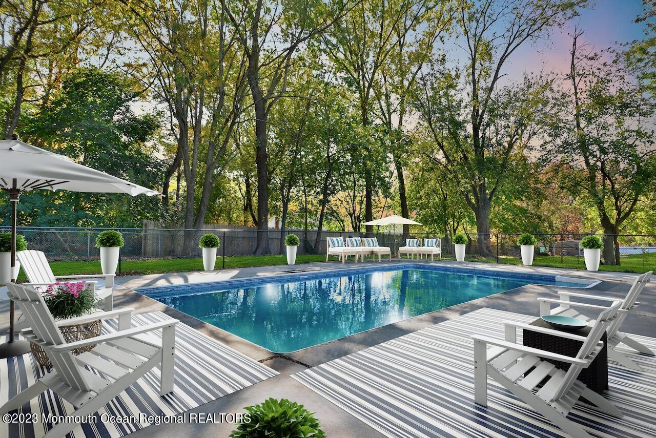6 Wickatunk Road Manalapan, NJ 07726 - Photo 2 of 35 a view of a house with pool and sitting area