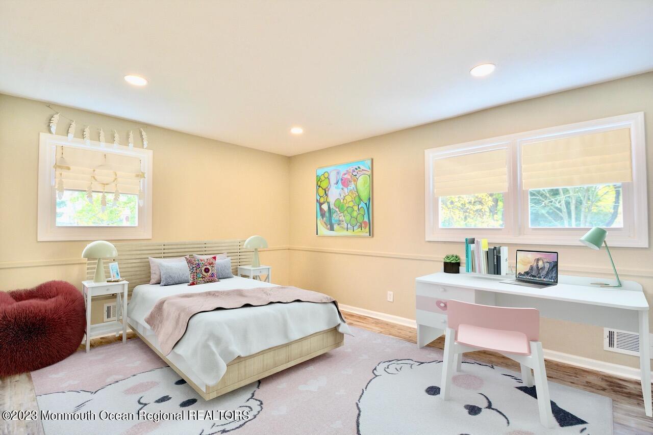 6 Wickatunk Road Manalapan, NJ 07726 - Photo 27 of 35 a bedroom with a bed and a table